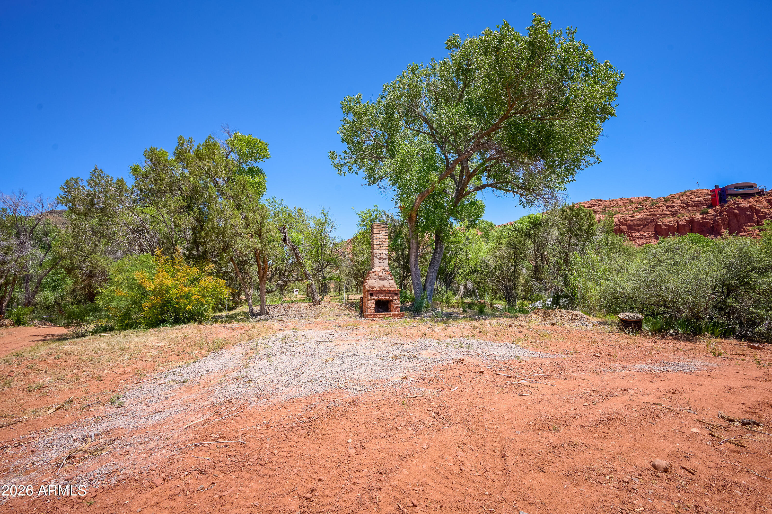 3155 Red Rock Loop Road, Unit 2 Sedona, AZ 86336 - Photo 14 of 22 a pathway of a field with large trees
