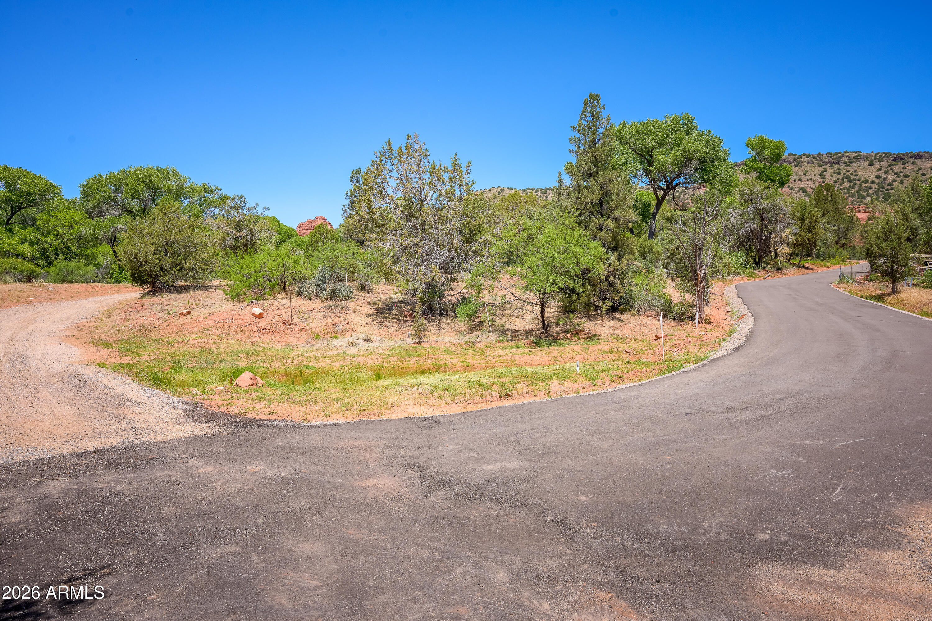 3155 Red Rock Loop Road, Unit 2 Sedona, AZ 86336 - Photo 10 of 22 a view of a swimming pool with a yard