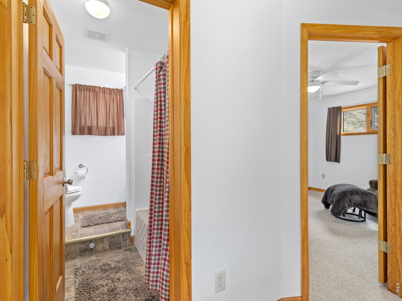 1002 Streamside Drive Drake, CO 80515 - Photo 24 of 37 a bathroom with a tub and shower