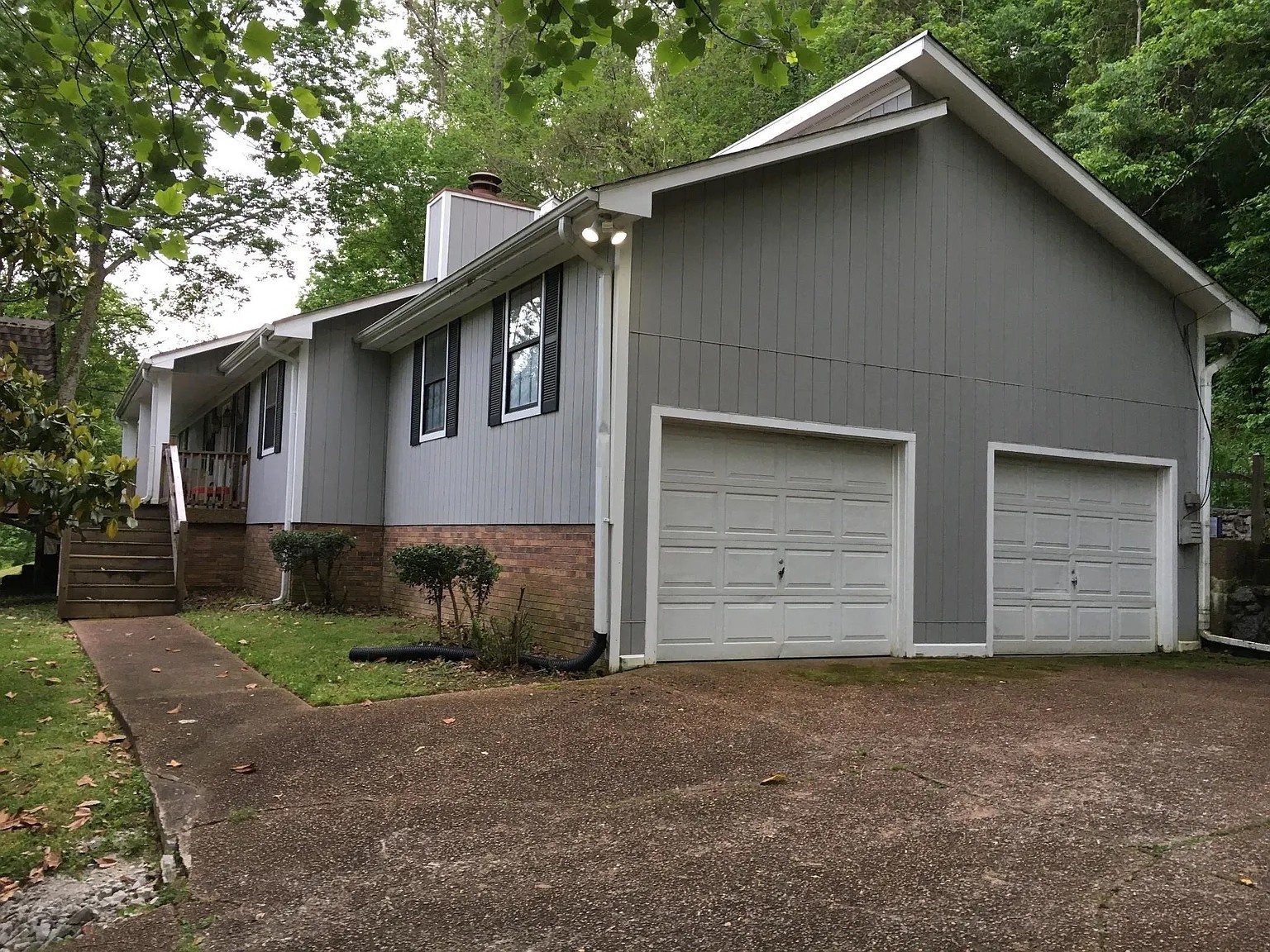 7420 Huntwick Trail Nashville, TN 37221 - Photo 1 of 19 a front view of a house with a yard