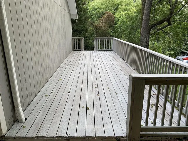 a balcony with wooden floor