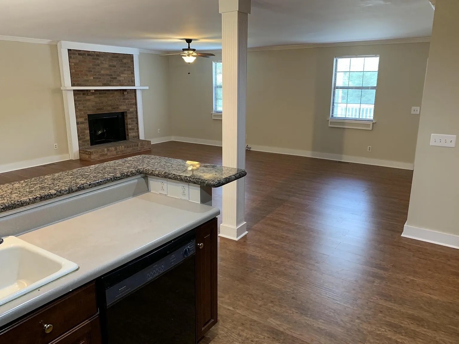 7420 Huntwick Trail Nashville, TN 37221 - Photo 7 of 19 an empty room with wooden floor fireplace and windows