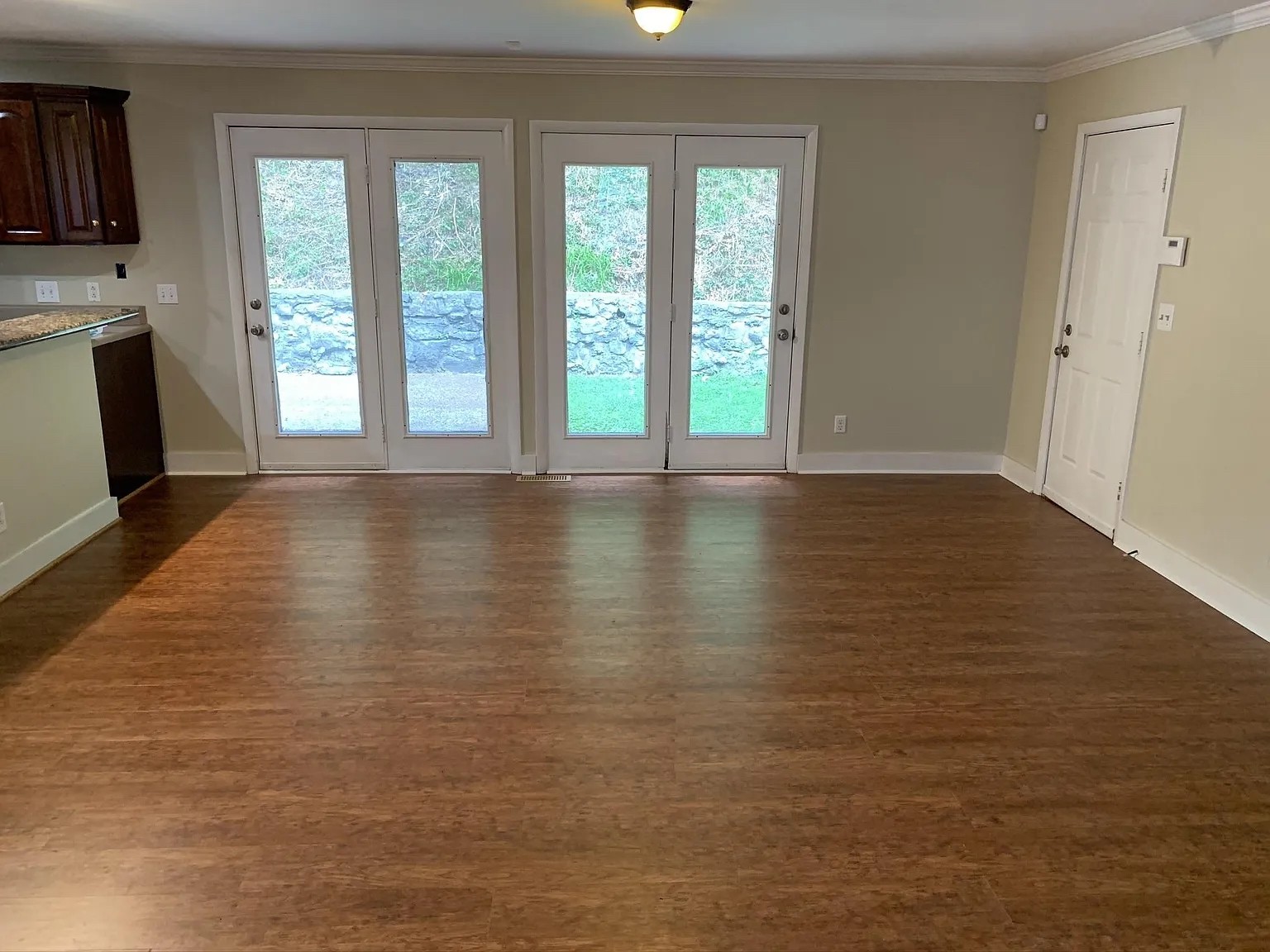 7420 Huntwick Trail Nashville, TN 37221 - Photo 9 of 19 a view of an empty room with a window and wooden floor