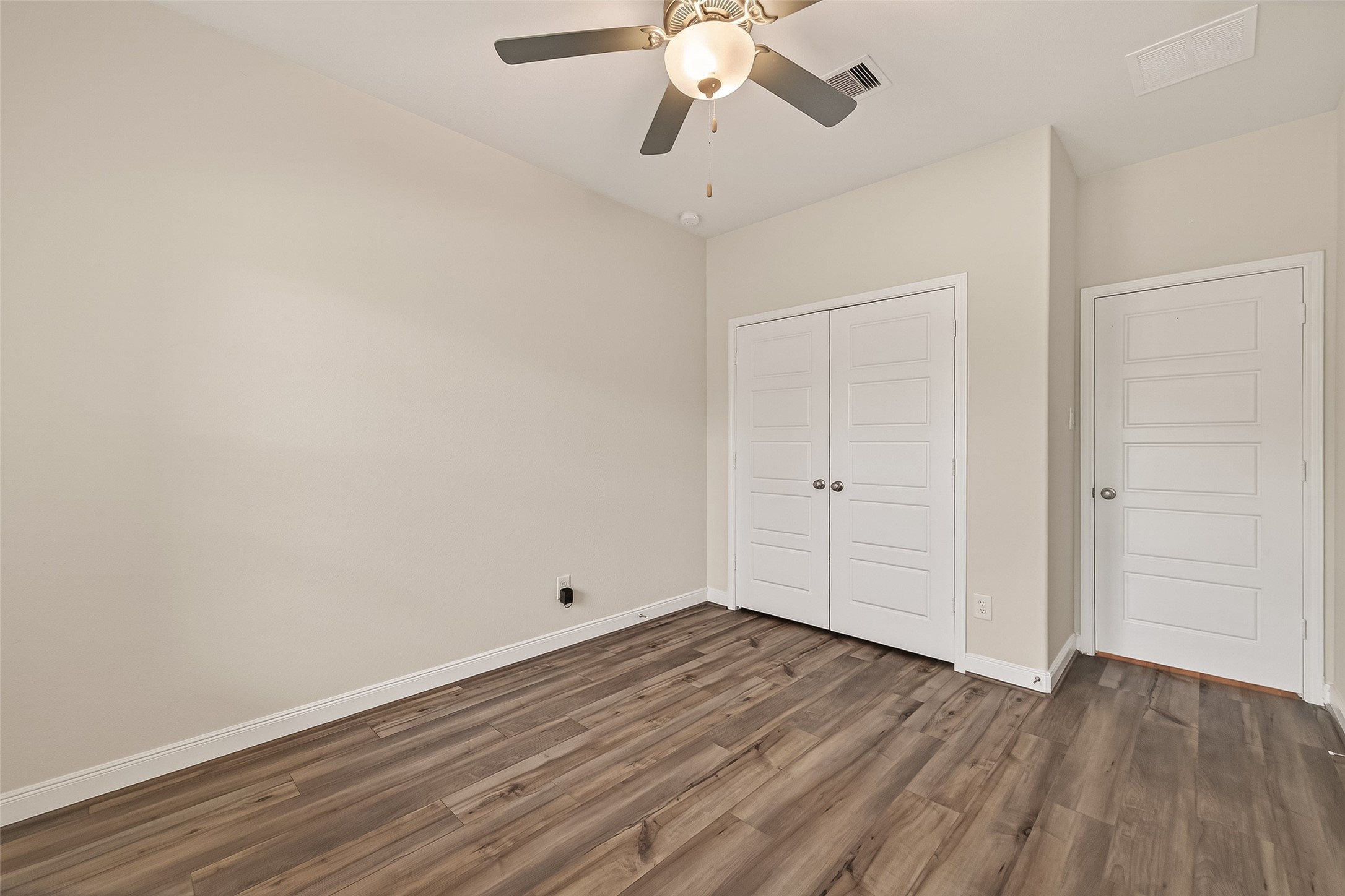 4231 Reese Ravine Lane Katy, TX 77493 - Photo 17 of 32 Another look at the first floor bedroom with easy to care for vinyl flooring and a spacious closet