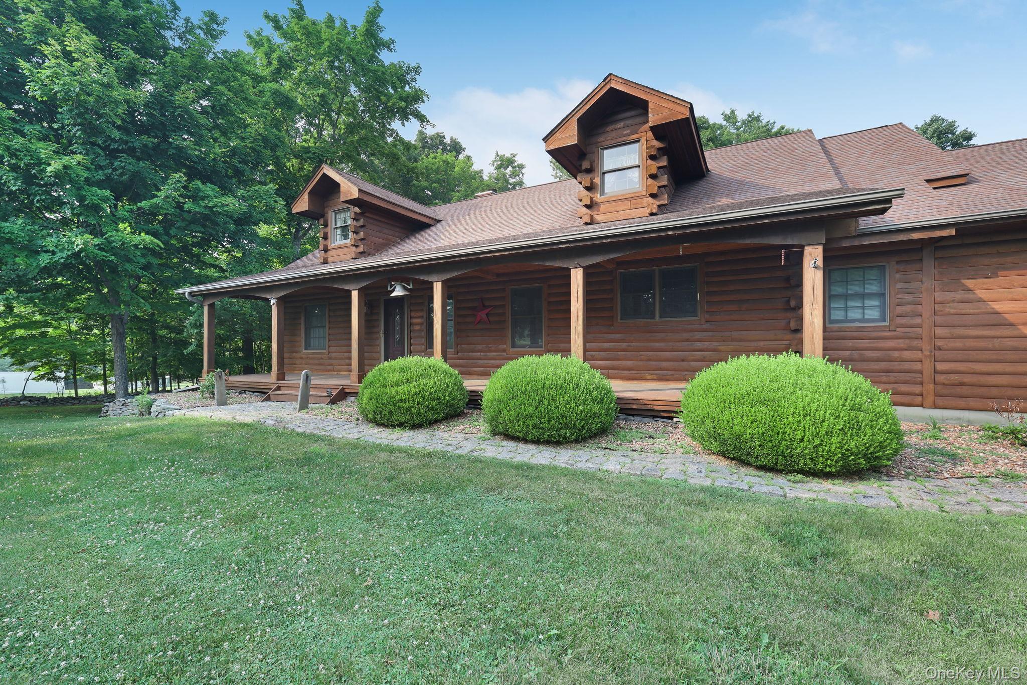 230 Post Road Slate Hill, NY 10973 - Photo 22 of 26 Mature landscaping and a paver walkway to the front porch.