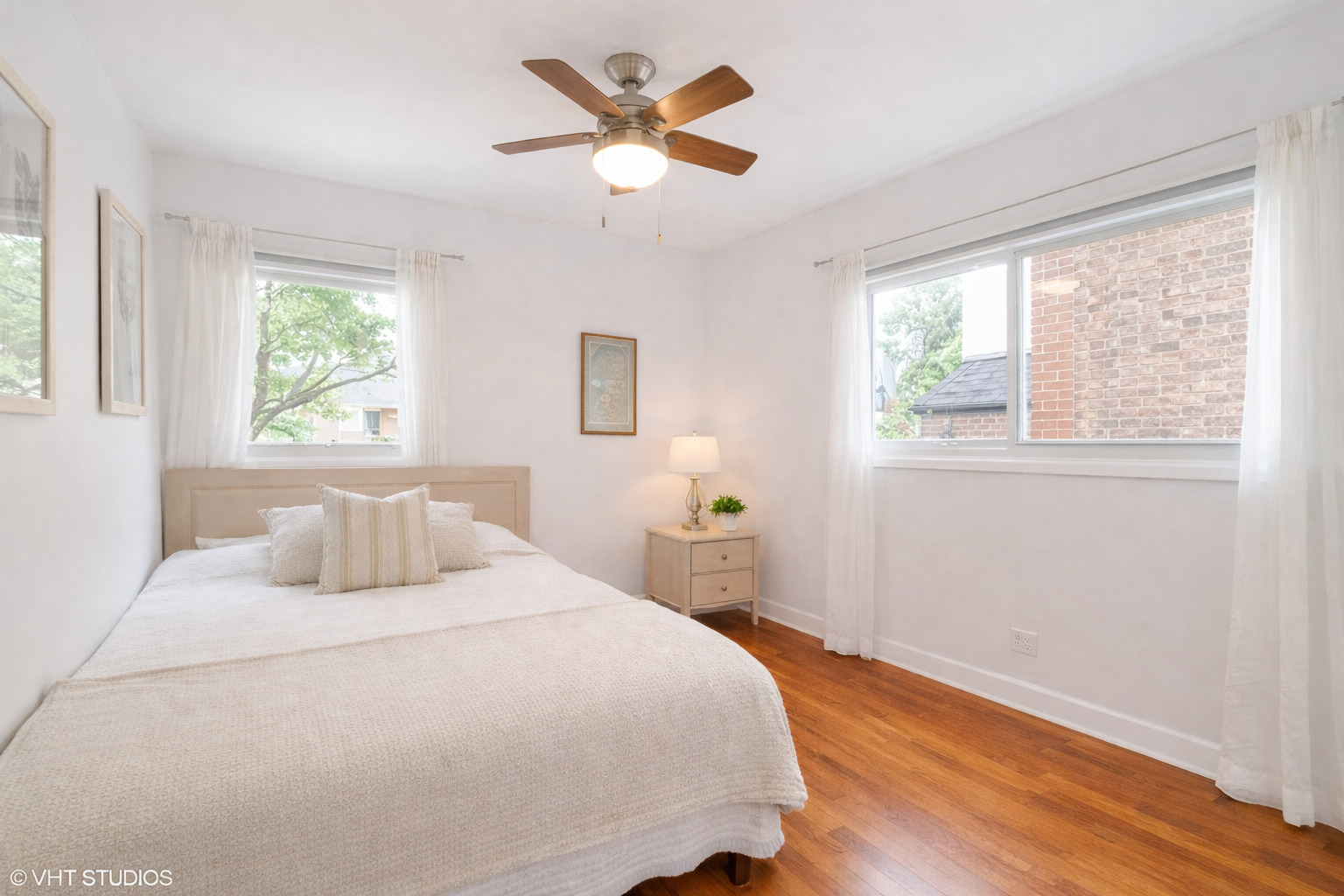 1045 West Altgeld Street, Unit A Chicago, IL 60614 - Photo 12 of 17 a bedroom with a bed and a large window