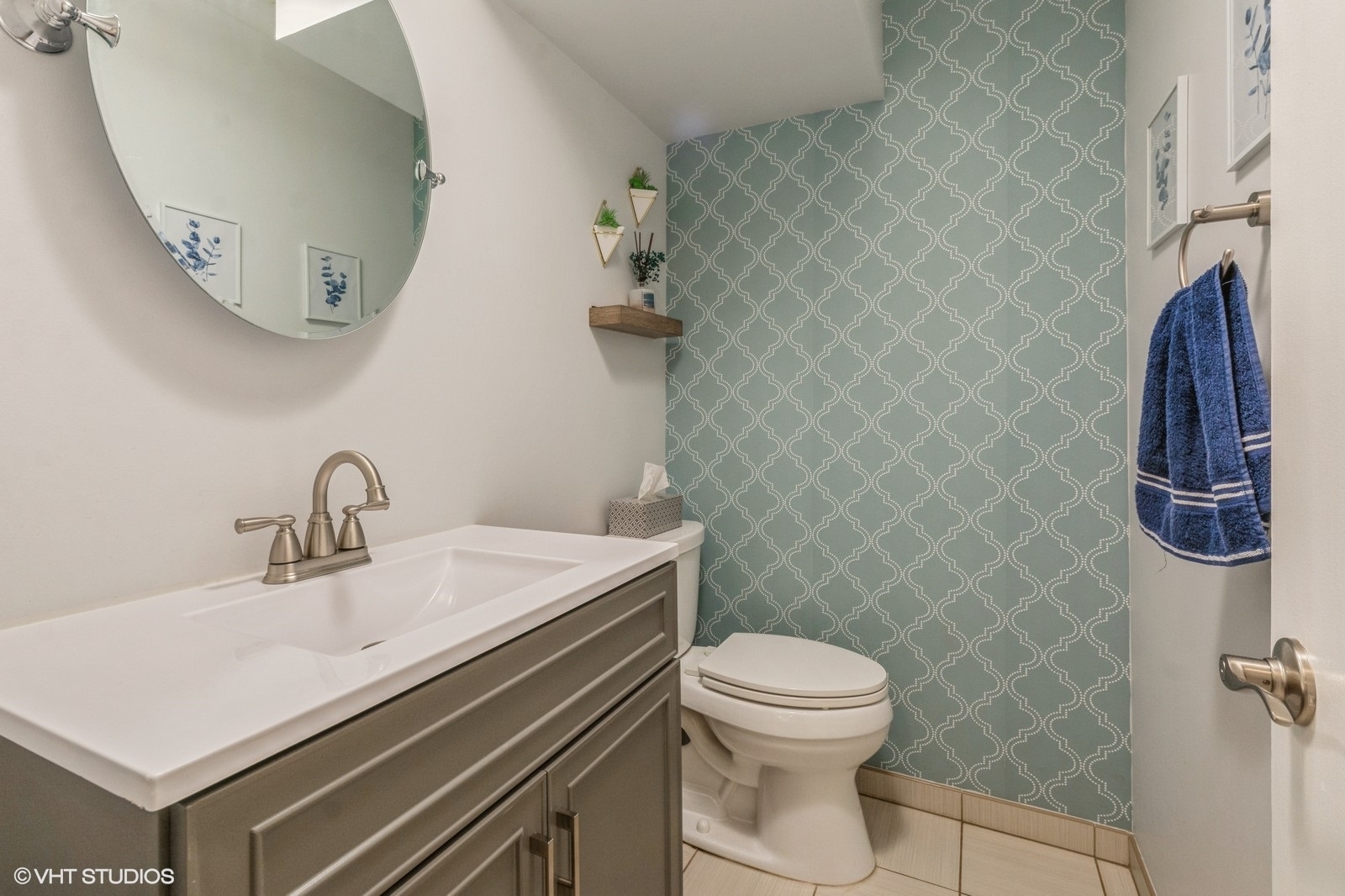 1045 West Altgeld Street, Unit A Chicago, IL 60614 - Photo 14 of 17 a bathroom with a sink a toilet and a mirror
