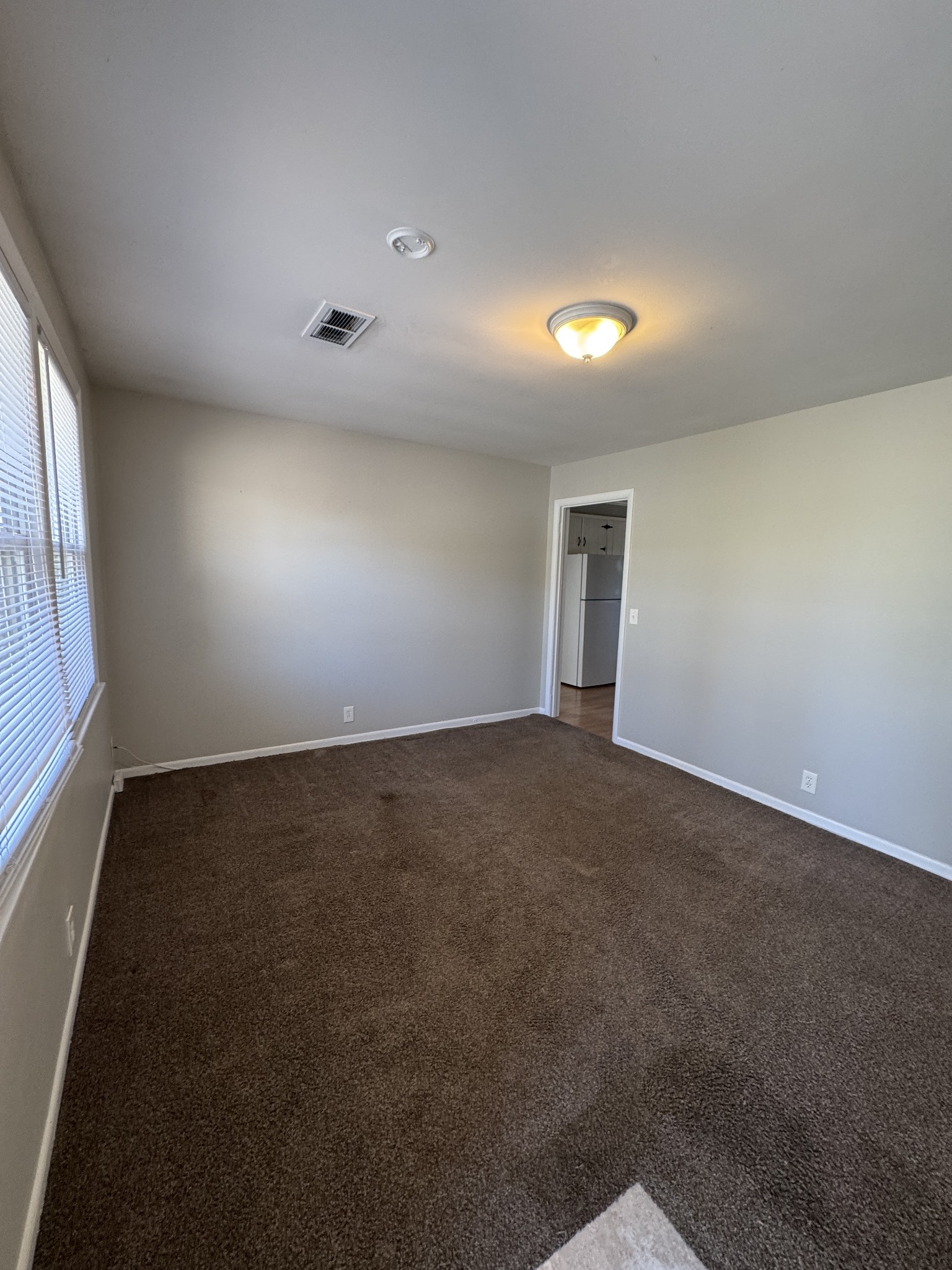 929 Allen Road, Unit B Nashville, TN 37214 - Photo 2 of 7 an empty room with a empty space and windows
