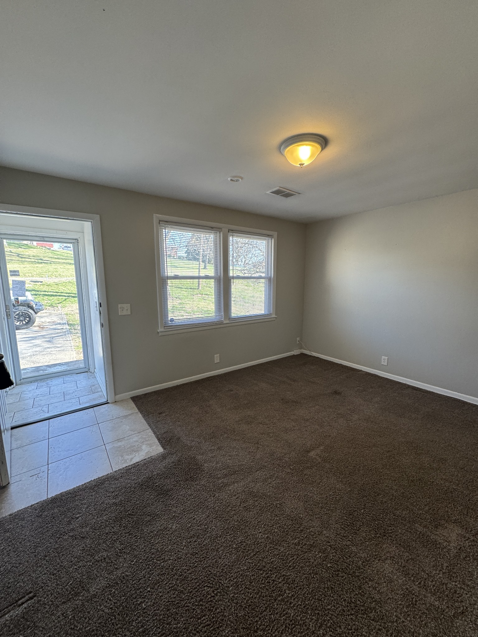 929 Allen Road, Unit B Nashville, TN 37214 - Photo 3 of 7 an empty room with windows