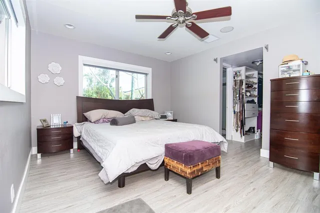 a bedroom with a bed and window