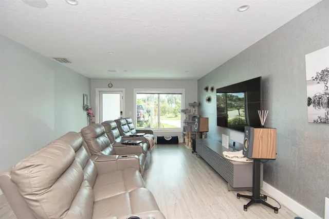 a living room with furniture or couch and a window