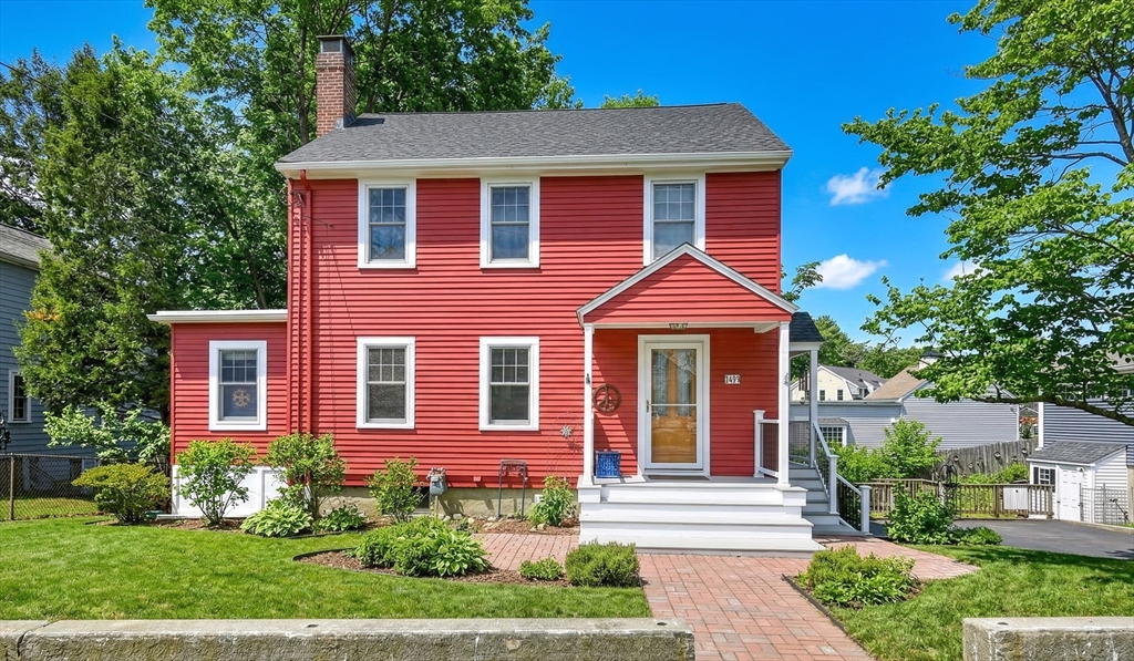 49 Pond Street Westwood, MA 02090 - Photo 1 of 36 a front view of a house with garden