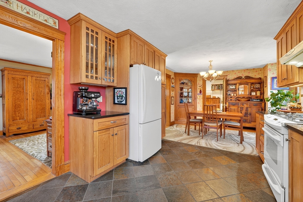 49 Pond Street Westwood, MA 02090 - Photo 11 of 36 a kitchen with stainless steel appliances granite countertop a refrigerator and a stove