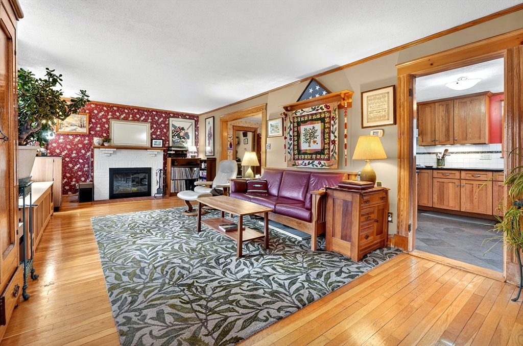 49 Pond Street Westwood, MA 02090 - Photo 2 of 36 a living room with furniture fireplace and wooden floor
