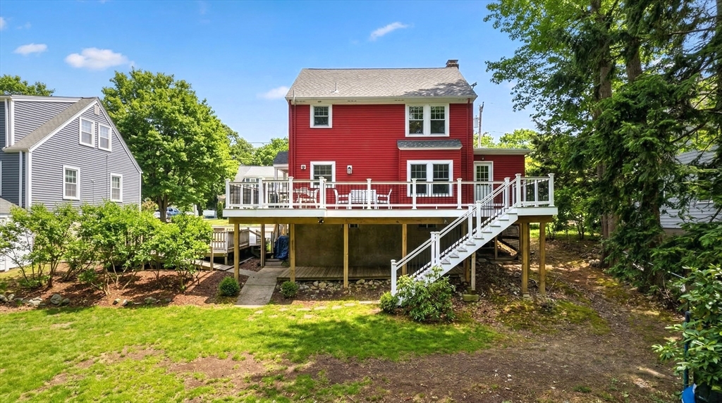 49 Pond Street Westwood, MA 02090 - Photo 31 of 36 a view of a house with a backyard porch and sitting area