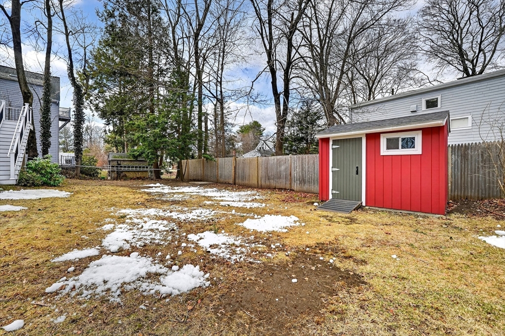 49 Pond Street Westwood, MA 02090 - Photo 33 of 36 a view of a yard with a house and a tree