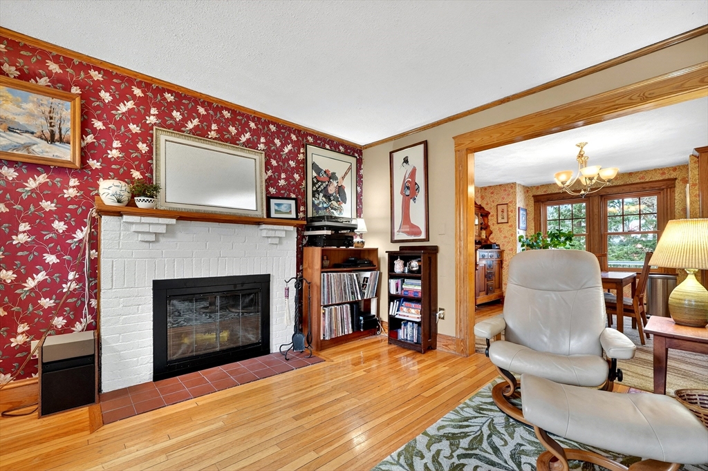 49 Pond Street Westwood, MA 02090 - Photo 4 of 36 a living room with furniture a flat screen tv and a fireplace
