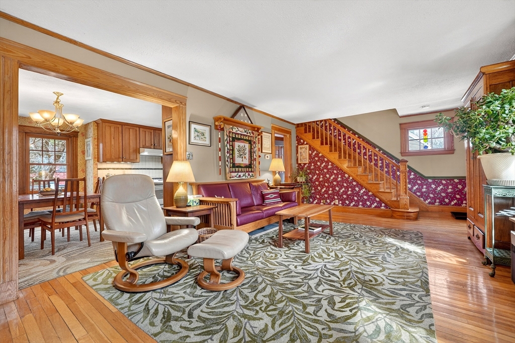 49 Pond Street Westwood, MA 02090 - Photo 5 of 36 a living room with furniture a rug and a floor to ceiling window
