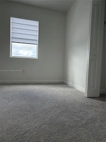 a view of a room that has a window in it