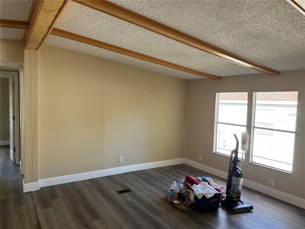 7229 Allyson Street Port Richey, FL 34668 - Photo 5 of 11 a room with wooden floor and a window