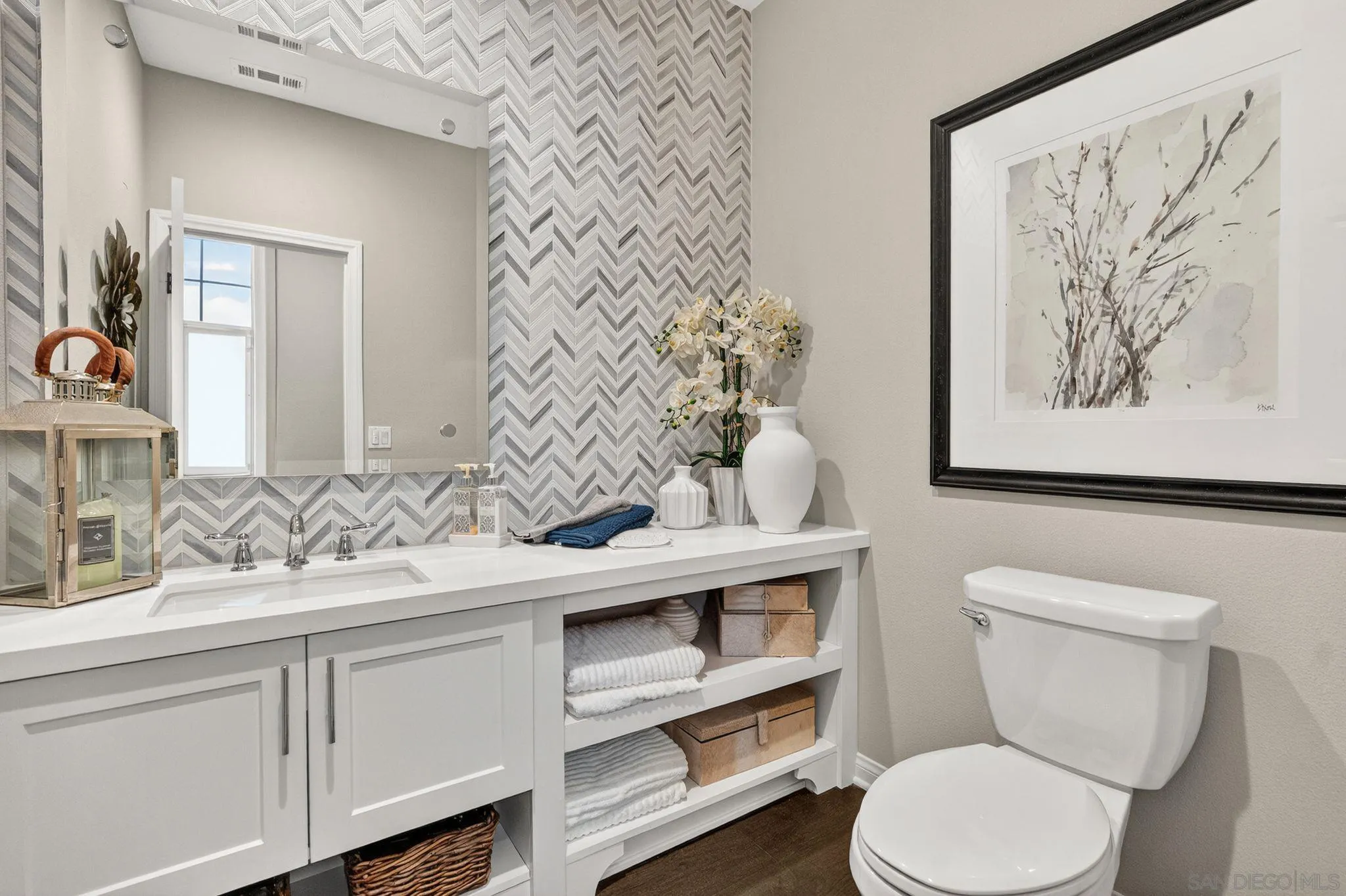 21509 Wilgen Road Escondido, CA 92029 - Photo 26 of 37 a bathroom with a toilet sink and mirror