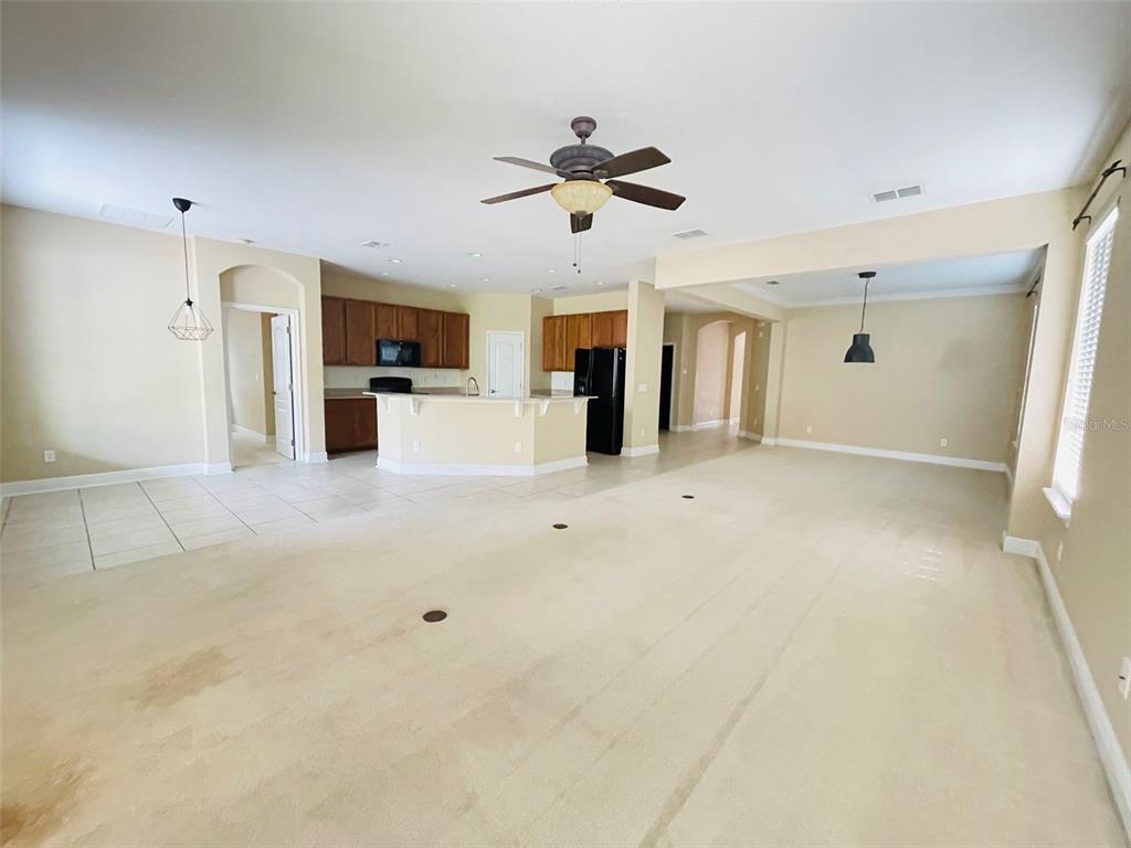 13645 Riggs Way Windermere, FL 34786 - Photo 4 of 12 a view of a kitchen with a sink and a refrigerator