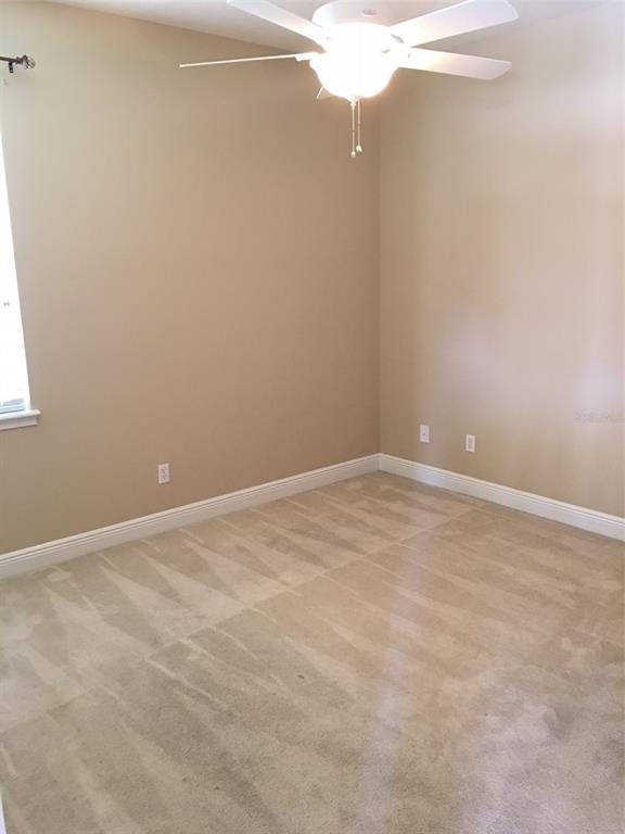 13645 Riggs Way Windermere, FL 34786 - Photo 7 of 12 a view of an empty room with a window