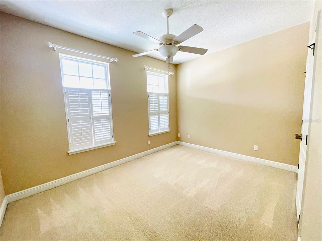 13645 Riggs Way Windermere, FL 34786 - Photo 10 of 12 a view of an empty room with a window