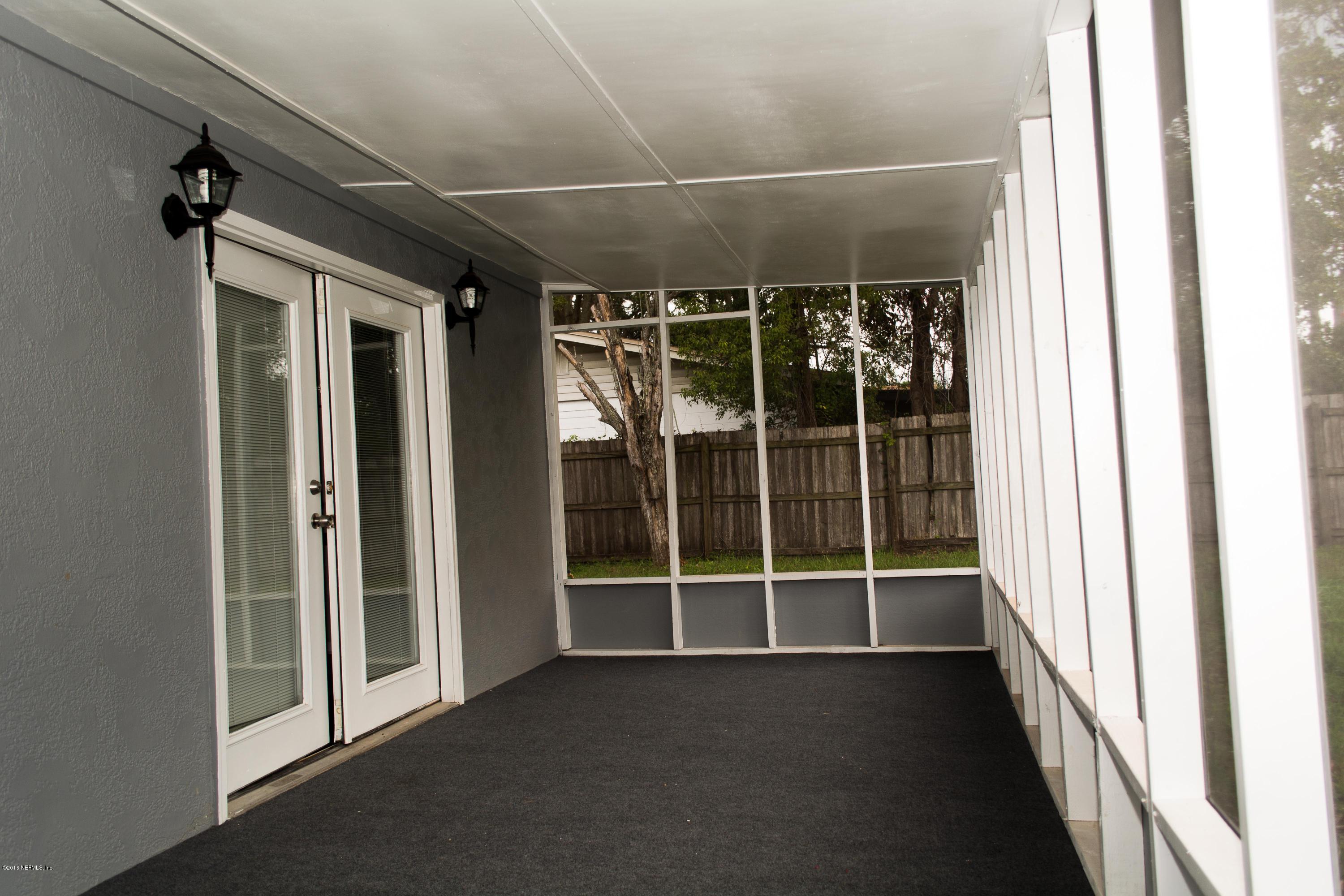 4133 Dayrl Road Jacksonville, FL 32207 - Photo 18 of 21 a view of a glass door and a window