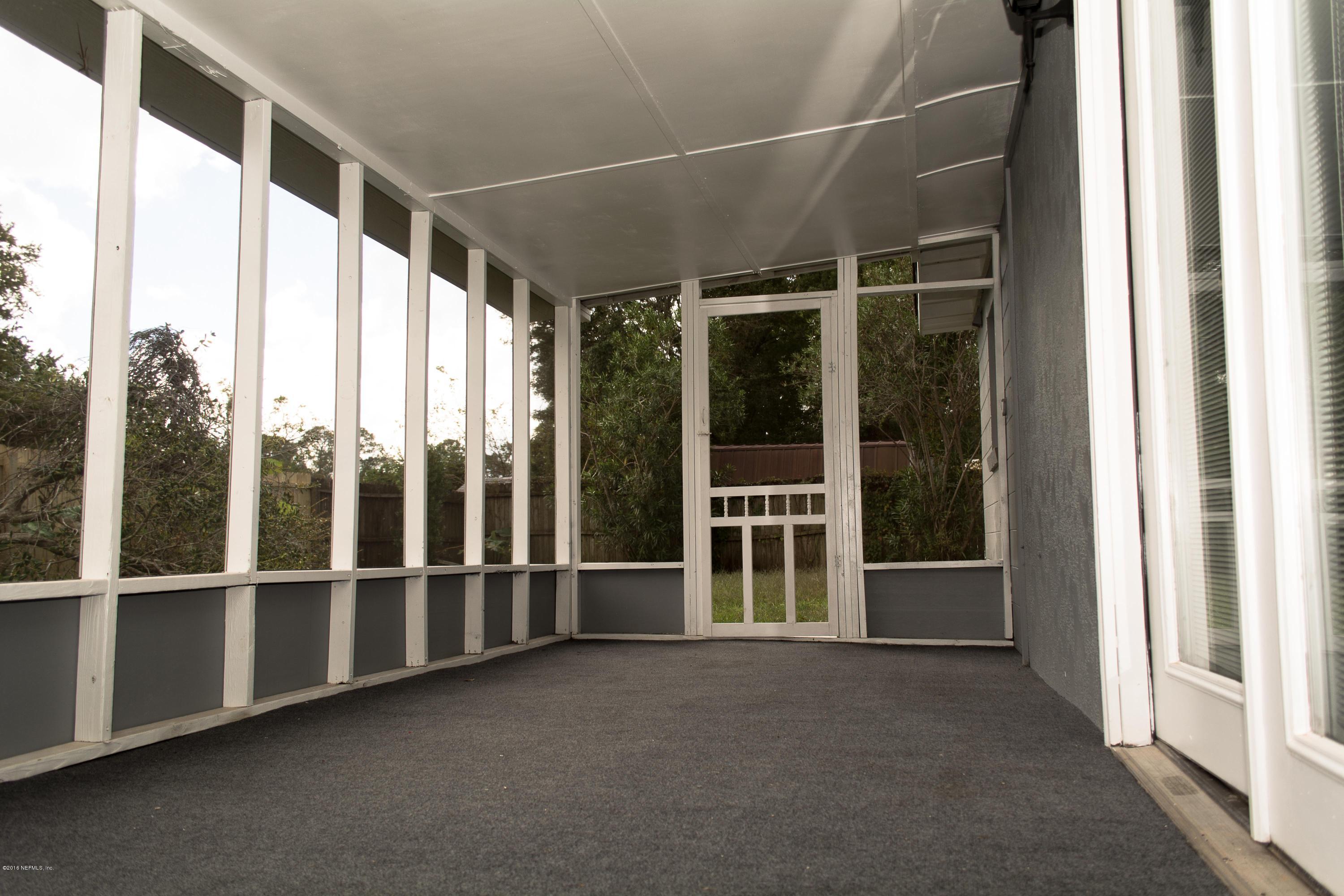 4133 Dayrl Road Jacksonville, FL 32207 - Photo 19 of 21 a view of an empty room with windows