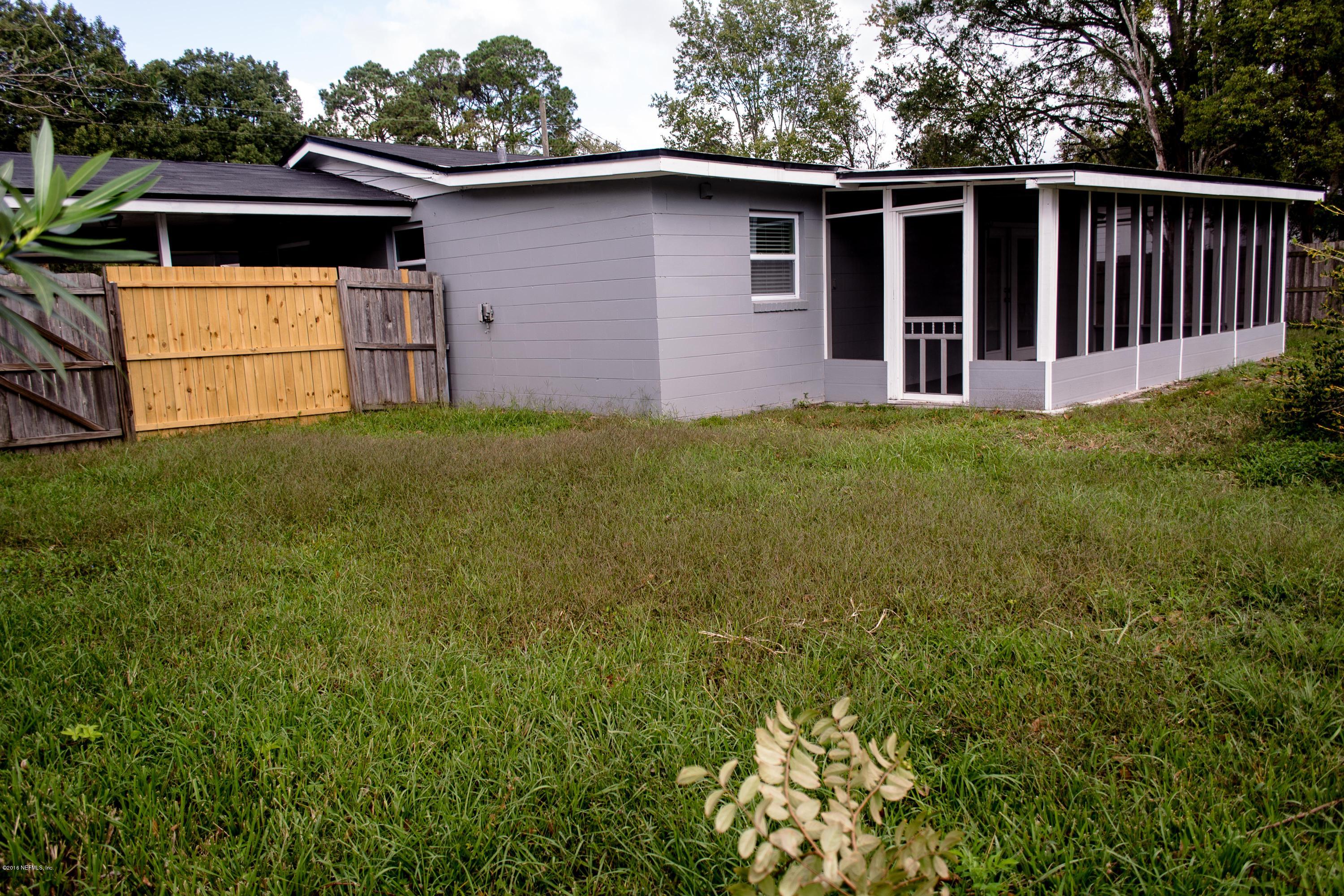 4133 Dayrl Road Jacksonville, FL 32207 - Photo 21 of 21 a front view of a house with garden