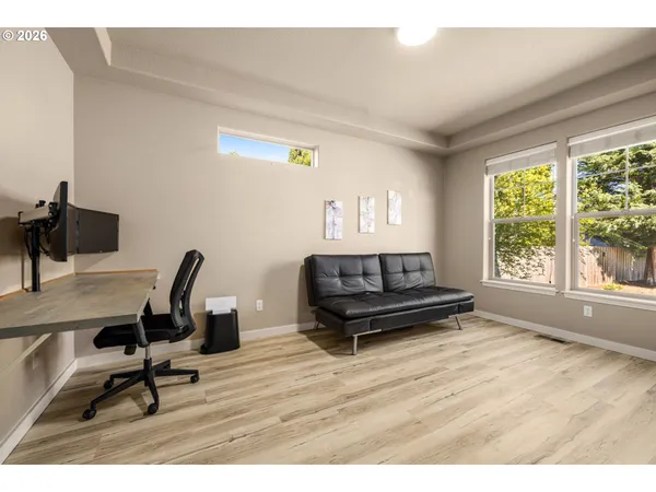 a living room with a couch and a window