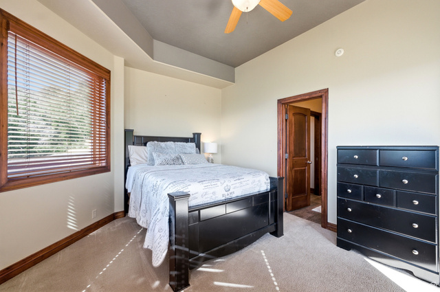 335 Bern Way Midway, UT 84049 - Photo 48 of 88 Carpeted bedroom featuring a large window with wood-finish blinds and trim