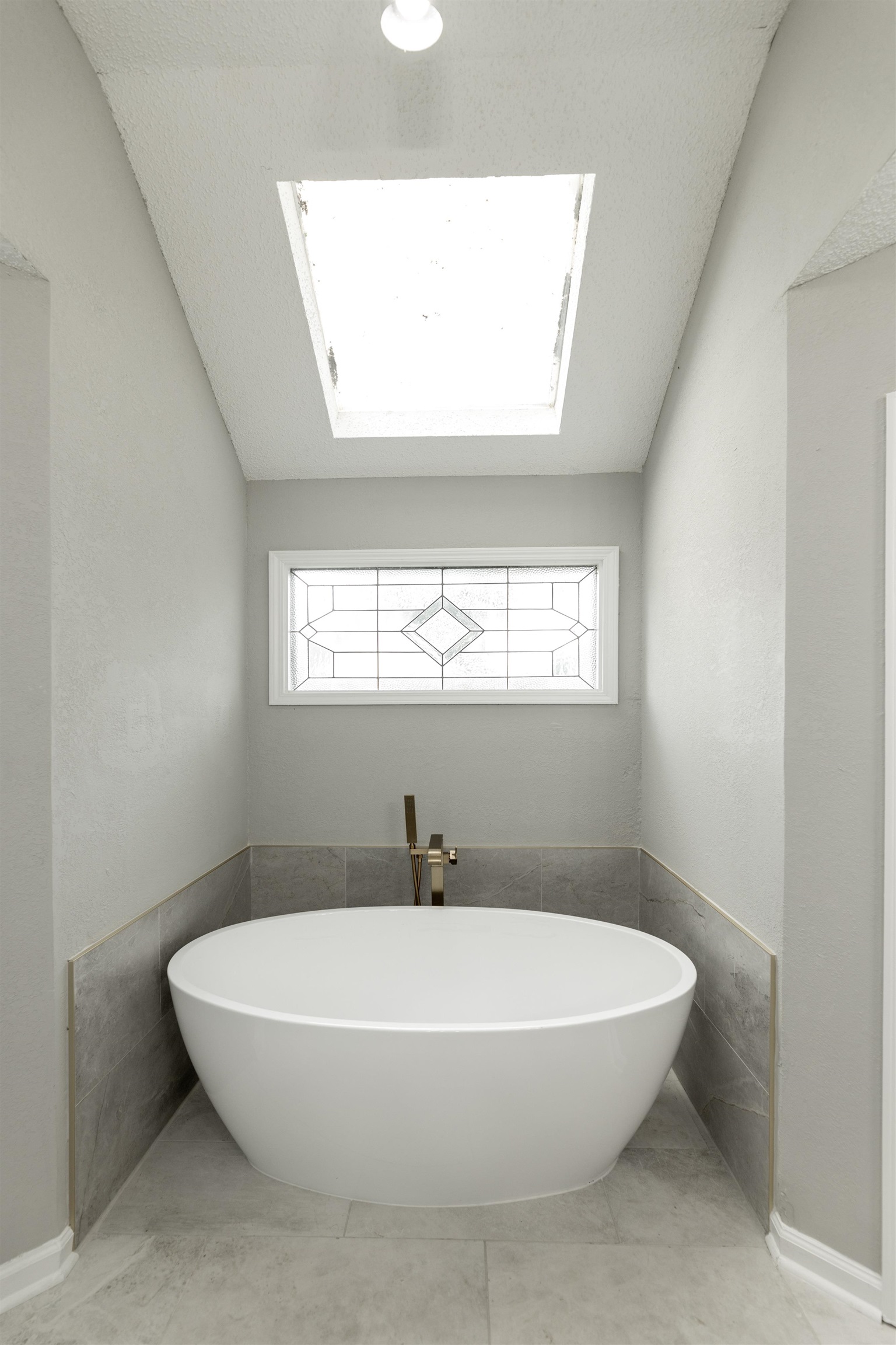 7421 Richmond Road Memphis, TN 38125 - Photo 27 of 39 Freestanding soaking tub with a modern brass floor-mounted faucet