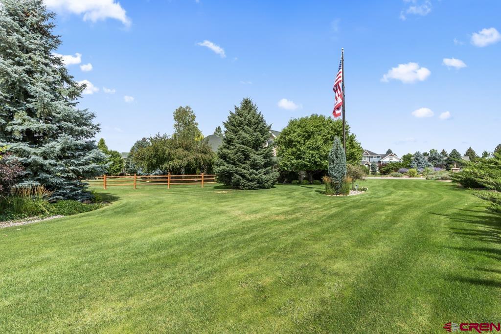 15103 6260th Road Montrose, CO 81403 - Photo 8 of 45 a front view of a house with a yard