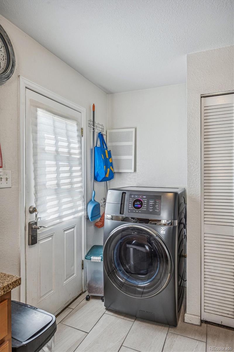 631 South Raleigh Street Denver, CO 80219 - Photo 8 of 15 a utility room with dryer and washer