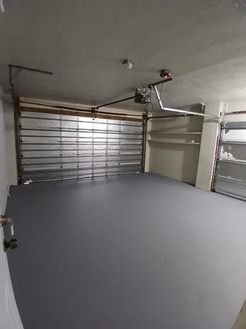 a view of empty room with air conditioner and window