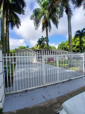 a view of a balcony with a palm tree