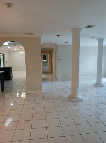 a view of a livingroom with an empty space and a sink