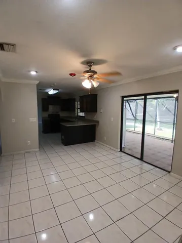 a view of a livingroom with a furniture chandelier and window