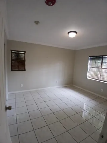 a view of an empty room and window