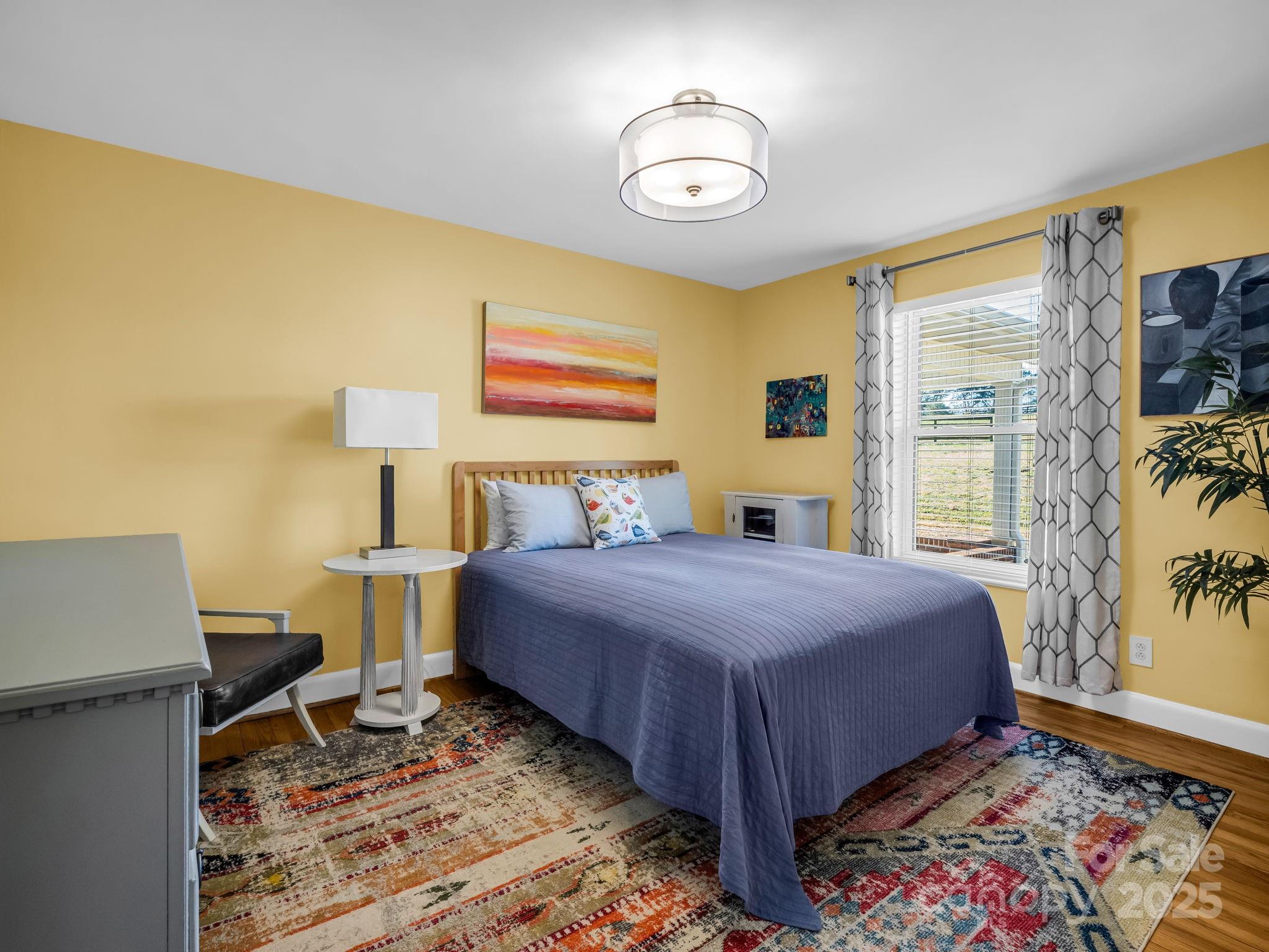 505 Crawley Gin Road Shelby, NC 28150 - Photo 14 of 48 a bedroom with a bed and wooden floor