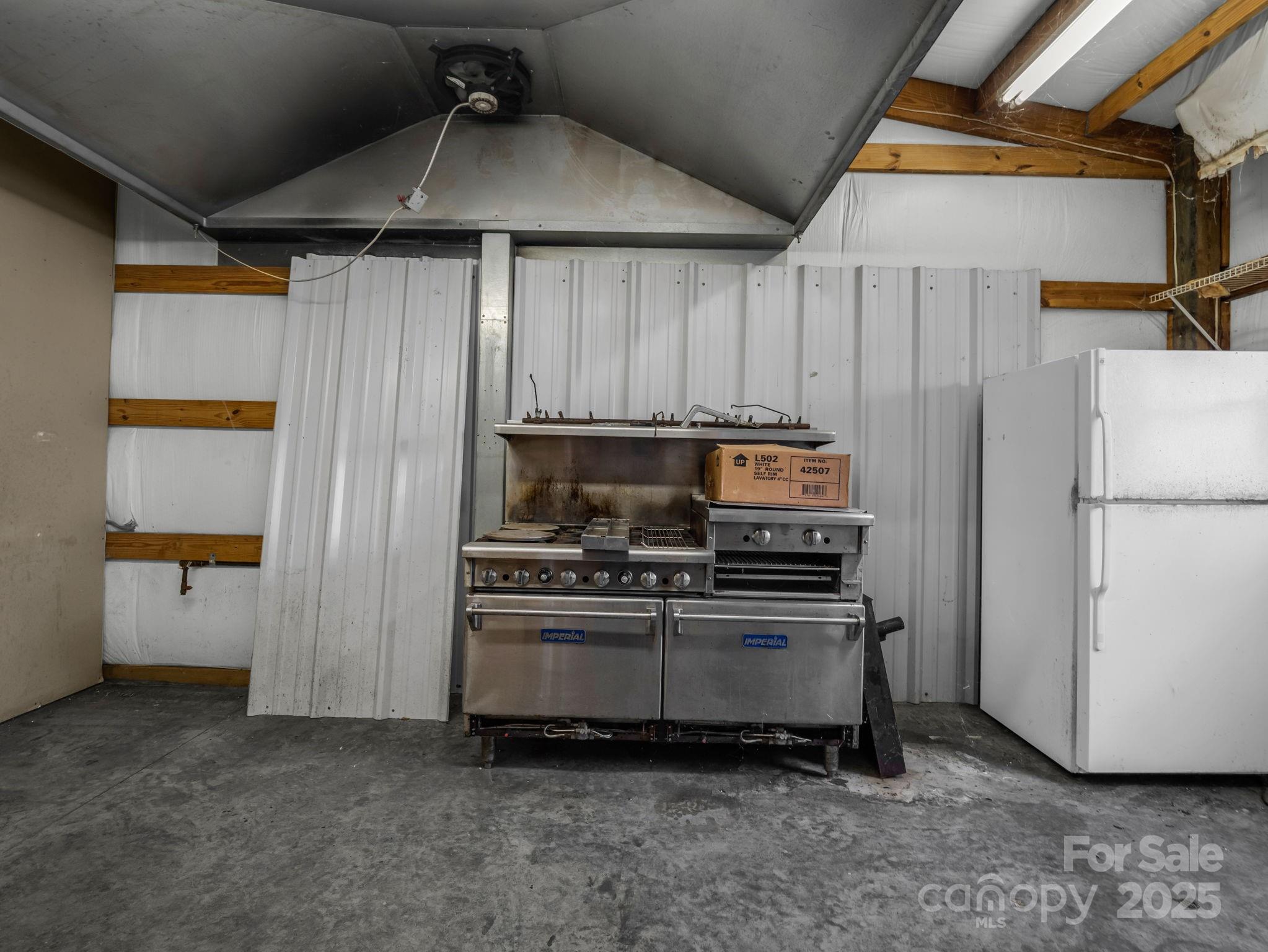 505 Crawley Gin Road Shelby, NC 28150 - Photo 31 of 48 a kitchen with a stove and a refrigerator