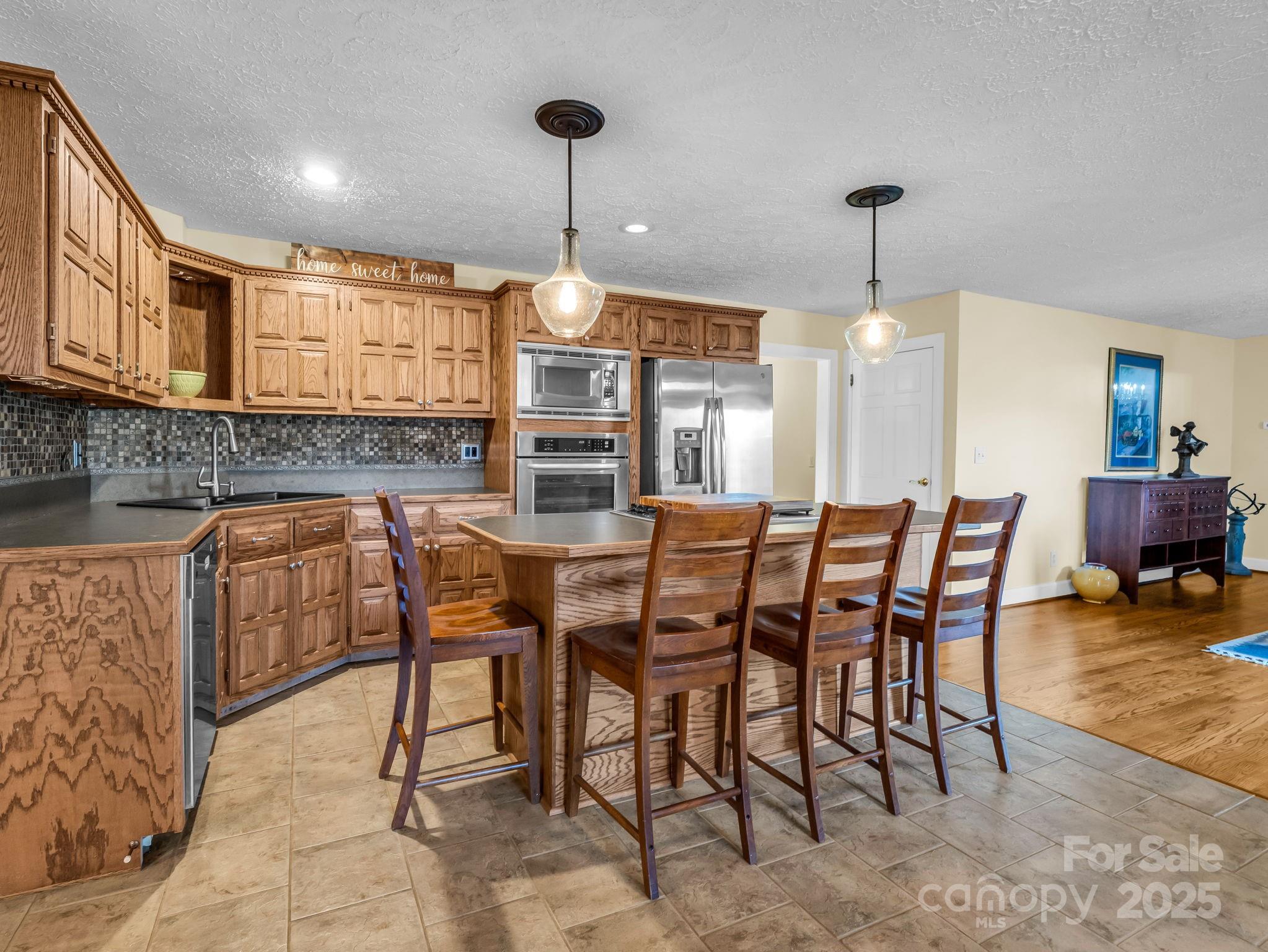 505 Crawley Gin Road Shelby, NC 28150 - Photo 5 of 48 a dining room with furniture a chandelier and wooden floor