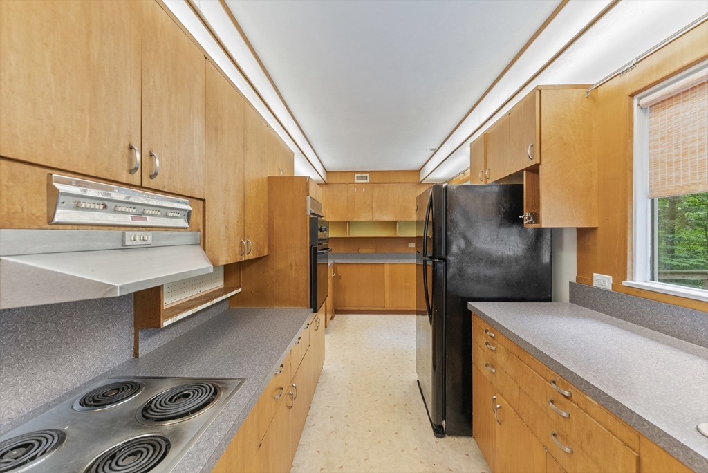 505 Mountain Road Wilbraham, MA 01095 - Photo 11 of 35 a kitchen with a refrigerator and a stove