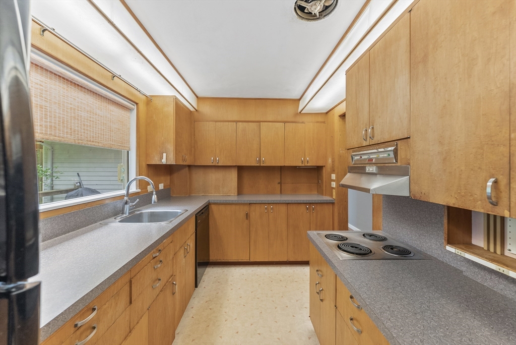 505 Mountain Road Wilbraham, MA 01095 - Photo 12 of 35 a kitchen with granite countertop a sink a stove and cabinets