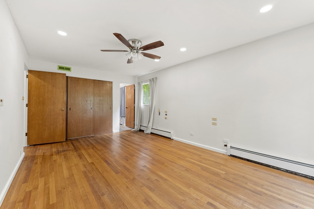 505 Mountain Road Wilbraham, MA 01095 - Photo 18 of 35 an empty room with wooden floor and windows