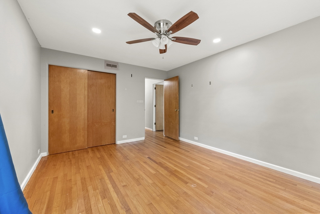 505 Mountain Road Wilbraham, MA 01095 - Photo 23 of 35 an empty room with wooden floor and ceiling fan