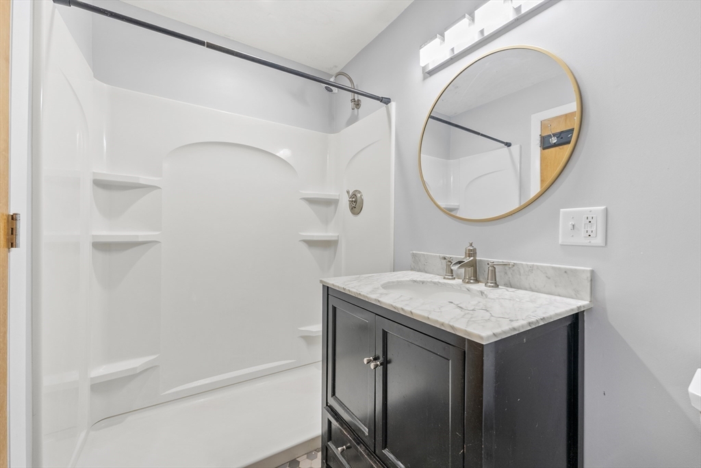 505 Mountain Road Wilbraham, MA 01095 - Photo 25 of 35 a bathroom with a sink and a mirror