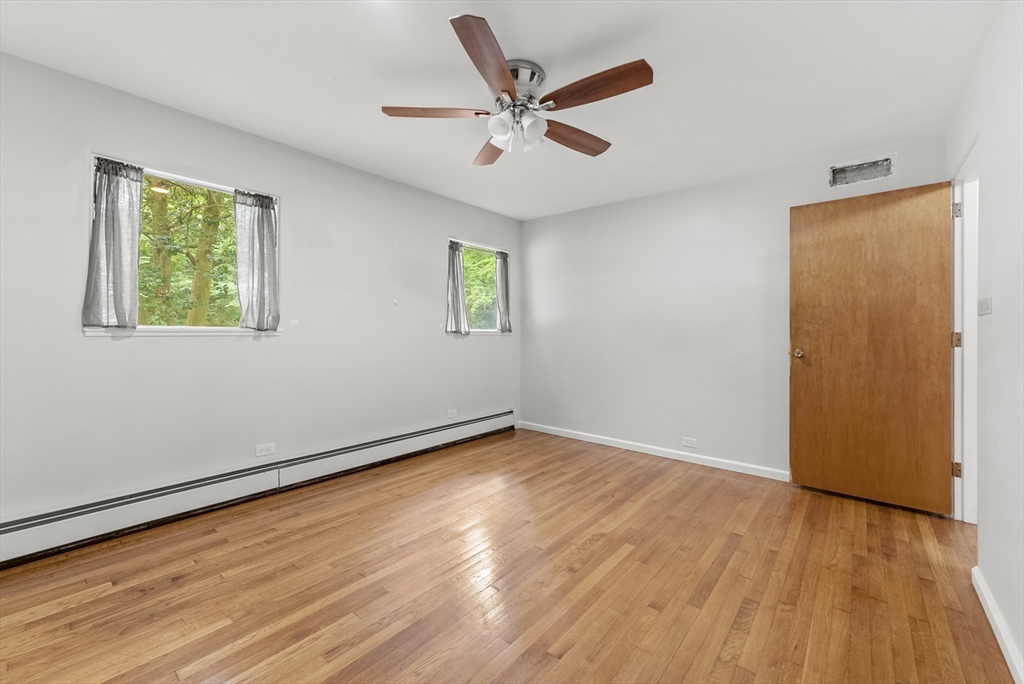 505 Mountain Road Wilbraham, MA 01095 - Photo 29 of 35 an empty room with wooden floor and windows